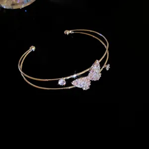 Sparkling double-layer gold butterfly cuff bangle with shiny cubic zirconia crystals