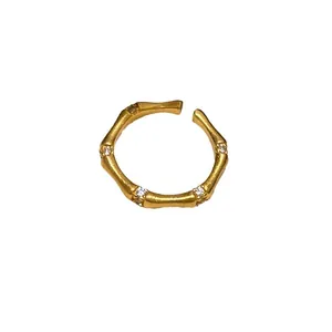 Vintage brushed bamboo joint adjustable open ring with sparkling zircon accents.