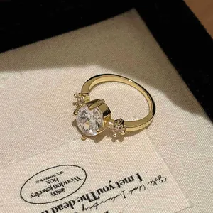 Close-up of gold-plated vintage ring with sparkling zircon stone and star details