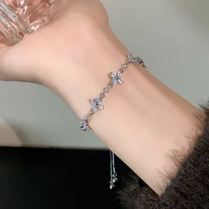 Close-up of elegant silver flower bracelet with sparkling zircon stones and an adjustable drawstring