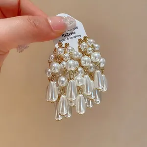 Elegant silver needle teardrop pearl tassel earrings with a French luxury aesthetic