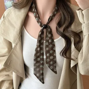Close-up detail of a vintage brown floral silk scarf necklace with black slider bead