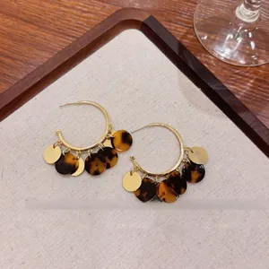 Elegant tortoiseshell tassel hoop earrings with gold accents for autumn and winter