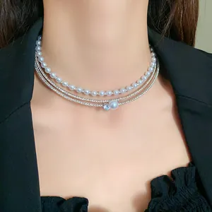 Close-up detail of a layered French style choker featuring faux pearls and sparkling zirconia stones.