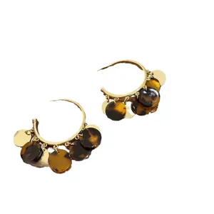 Retro gold hoop earrings featuring dark tortoiseshell and metallic gold disc tassel dangles