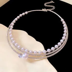 Macro view of multi-layered choker necklace showing exquisite pearls and zircon details