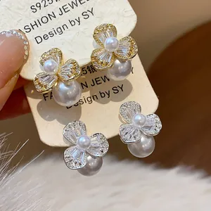 Exquisite close-up of S925 silver flower earrings with zircons and elegant dangling pearls