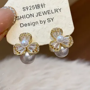 Detail view of French style zircon flower earrings with pearls and S925 silver needles