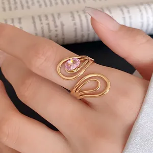 Exquisite hollow stainless steel open ring with a sparkling pink oval zircon gem.