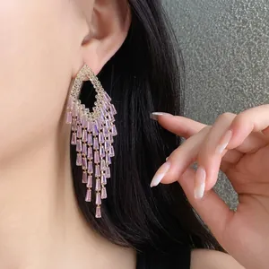 Elegant long tassel earrings featuring pink baguette zircons in a glamorous chandelier design