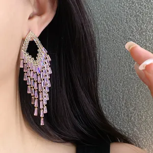 Detailed close-up showing pink baguette zircon tassel dangle earrings with elegant sparkle.