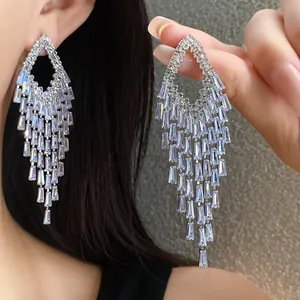 Detailed shot of heavy industry silver zircon rhombic tassel earrings showing brilliance