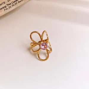 Detailed shot of a gold stainless steel flower ring with a pink zircon stone