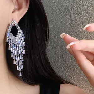 Detailed view of long zirconia tassel earrings with elegant diamond-shaped design