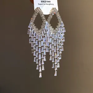 Detailed view of luxury long tassel chandelier earrings with sparkling cubic zirconia stones