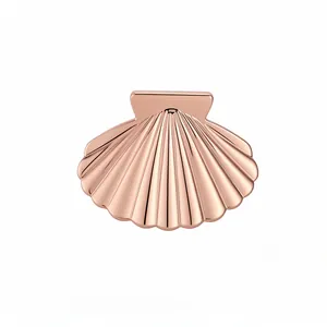 Elegant rose gold shell-shaped hair claw clip with a pleated texture for women
