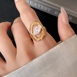 Detailed macro view of gold-plated stainless steel ring with marquise-cut zircon