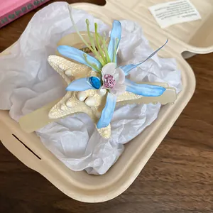 Elegant 3D starfish hair clip with blue flowers, perfect for summer vacation styles.
