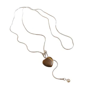 Vintage silver snake chain necklace with a heart-shaped tiger eye stone pendant