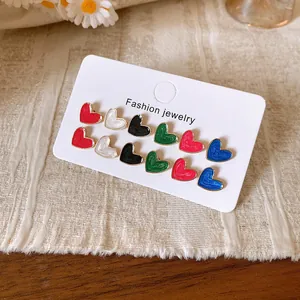 Detailed view of the twelve-piece heart-shaped stud earring set in multiple enamel colors