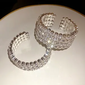 Luxurious silver-toned open cuff bracelet encrusted with sparkling round rhinestones