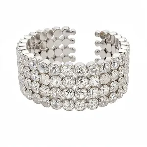 Elegant silver-colored cuff bracelet with three rows of clear sparkling rhinestones