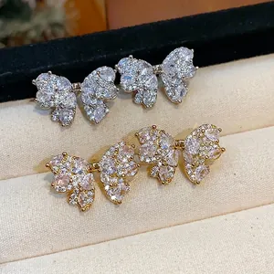 Elegant and luxury zircon pavé bow stud earrings available in gold and silver finishes