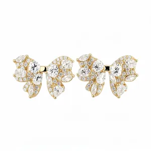 Elegant bow-knot stud earrings with sparkling clear zircon stones in a gold-tone finish