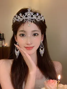 Close-up of elegant zircon flower tiara and matching earrings on a model for birthdays