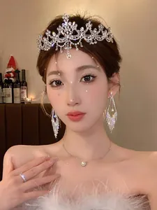 Elegant zircon flower tiara headband worn by a model for luxury bridal or birthday party looks.