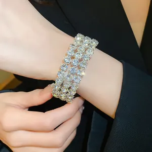 Detailed macro view of an elegant three-row sparkling rhinestone open cuff bracelet