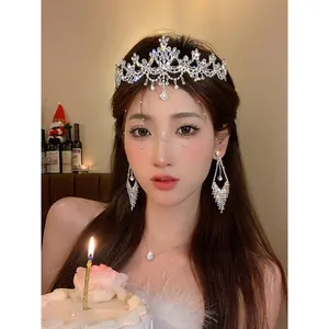 Elegant zircon flower tiara and jewelry set shown on model at a birthday celebration.