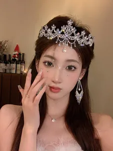 Detailed view of an elegant zircon flower tiara worn by a model for luxury styling
