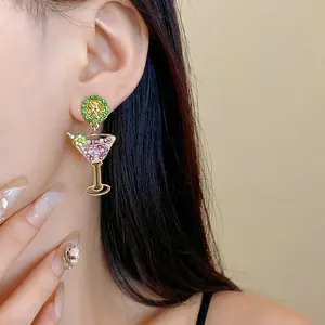 Elegant cocktail glass earrings with lime slice and pink rhinestones on Asian model