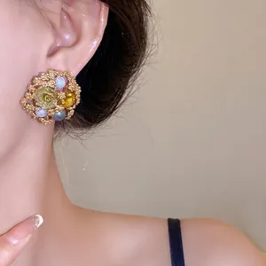 Vintage floral pearl stud earrings with rhinestones and delicate golden rose detail