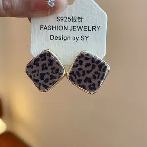 Detailed view of leopard print rhombic stud earrings featuring S925 silver needles
