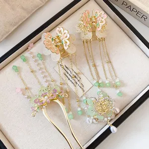 Macro detail of elegant Chinese butterfly hair clips with flowing tassels and beads
