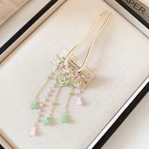 Detailed view of an elegant butterfly tassel hair fork with pearls for traditional Hanfu styling