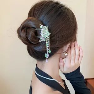 Close-up view of an elegant Chinese style butterfly hair claw clip with colorful tassels