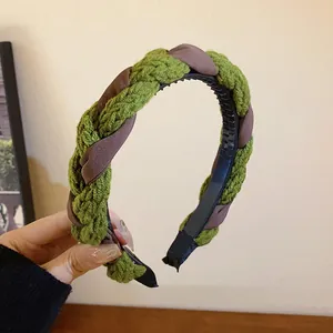 Stylish autumn winter braided headband in olive green and brown knit fabric material