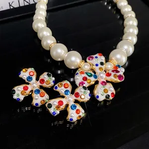 Luxury rhinestone pearl flower necklace and clip-on earring set for women