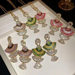 Detailed view of luxury fan-shaped rhinestone necklace and earring sets in gold