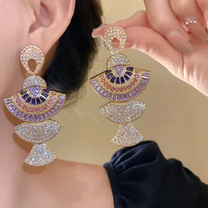 Elegant vintage fan-shaped earrings with purple crystals and sparkling rhinestones for women
