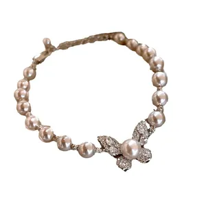 Elegant French vintage style butterfly faux pearl bracelet with sparkling rhinestone accents