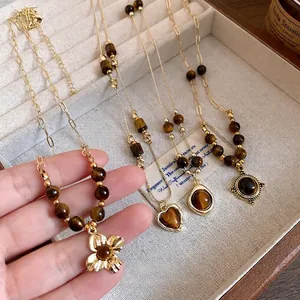 Vintage tiger eye beaded necklaces featuring heart and flower gold pendants for women