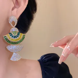 Detailed view of luxury vintage fan-shaped earrings with colorful sparkling rhinestones