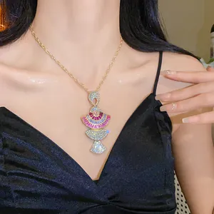 Elegant vintage necklace with fan-shaped crystal pendant and gold chain