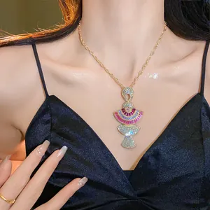 Detail of luxury vintage fan pendant necklace with pink and clear rhinestones