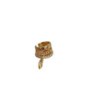 Layered golden ear cuff with quilted pattern, cubic zirconia, and heart charm pendant