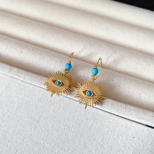 Bohemian golden evil eye sunburst dangle earrings with vibrant turquoise blue beads